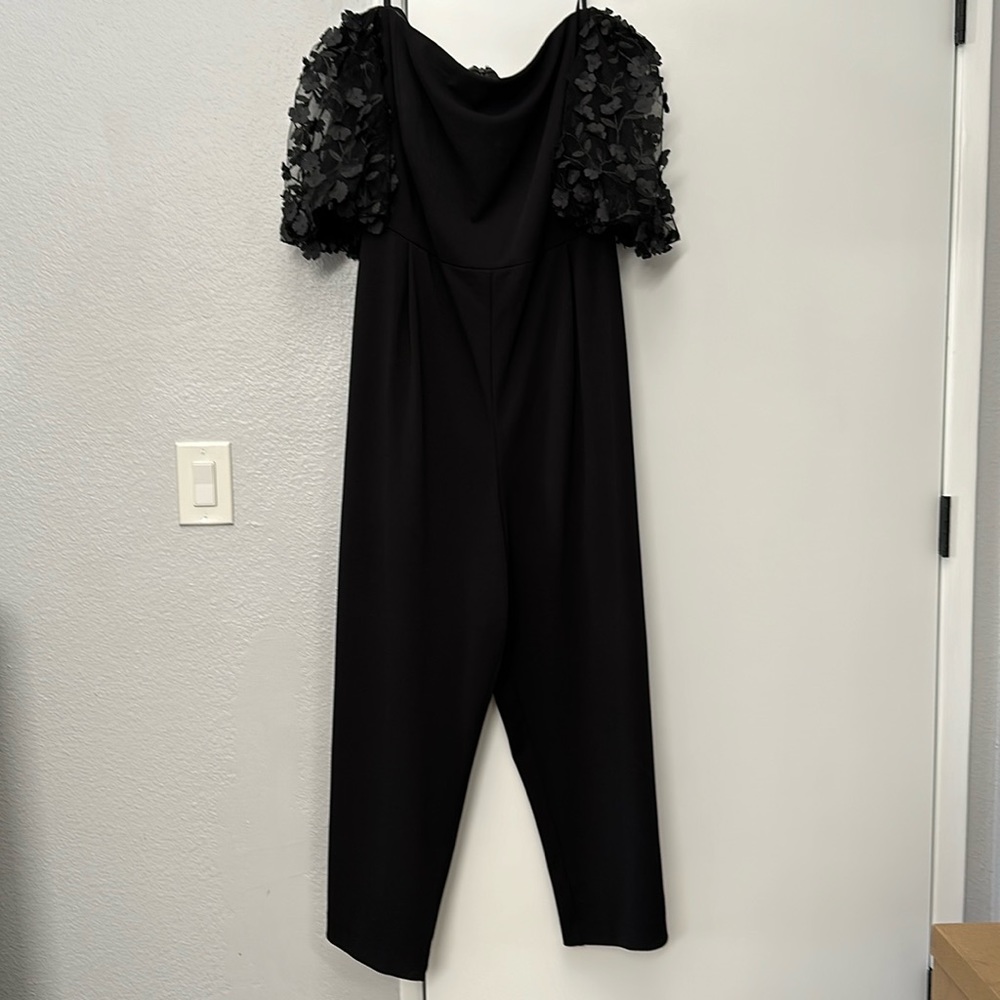 Black Xscape 22 jumpsuit with sheer 3D floral appliqué detail sleeves